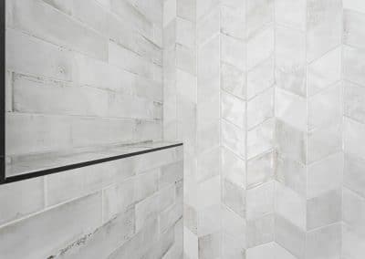A white tile made by home renovation contractors in Langley, BC