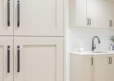 A picture of a white wooden kitchen cabinet with custom additions in Langley, BC
