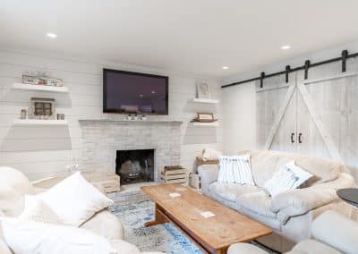 An image of a living room with large sofas that is made by home renovation contractors in Langley, BC