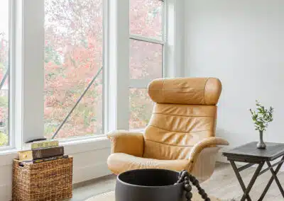 A second floor entertainment area with custom addition couch