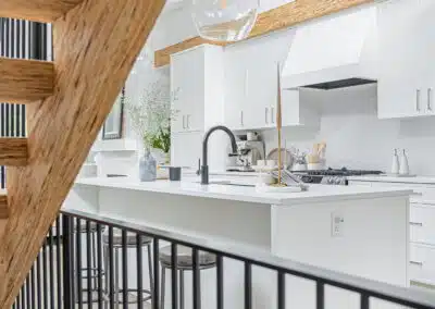 A white accent kitchen with modern industrial kitchen equipment by kitchen renovation contractor in Langley, BC