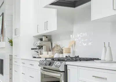 A white accent kitchen with modern industrial kitchen equipment by kitchen renovation contractor in Langley, BC