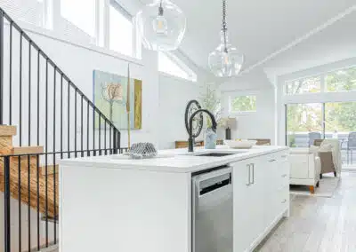 A white accent kitchen with modern industrial kitchen equipment by kitchen renovation contractor in Langley, BC