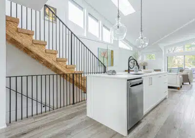 A white accent kitchen with modern industrial kitchen equipment by kitchen renovation contractor in Langley, BC