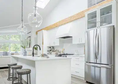 A white accent kitchen with modern industrial kitchen equipment by kitchen renovation contractor in Langley, BC