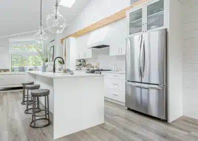 A white accent kitchen with modern industrial kitchen equipment by kitchen renovation contractor in Langley, BC