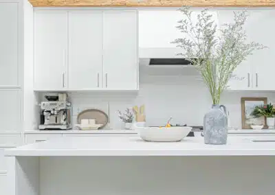 A white accent kitchen with modern industrial kitchen equipment by kitchen renovation contractor in Langley, BC