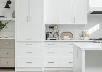 A white accent kitchen with modern industrial kitchen equipment by kitchen renovation contractor in Langley, BC