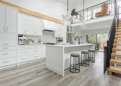 A white accent kitchen with modern industrial kitchen equipment by kitchen renovation contractor in Langley, BC