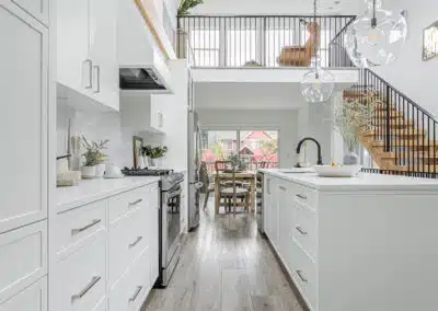 A white accent kitchen with modern industrial kitchen equipment by kitchen renovation contractor in Langley, BC