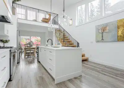 A white accent kitchen with modern industrial kitchen equipment by kitchen renovation contractor in Langley, BC