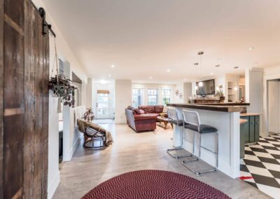 An interior space with a barn door and a kitchen counter