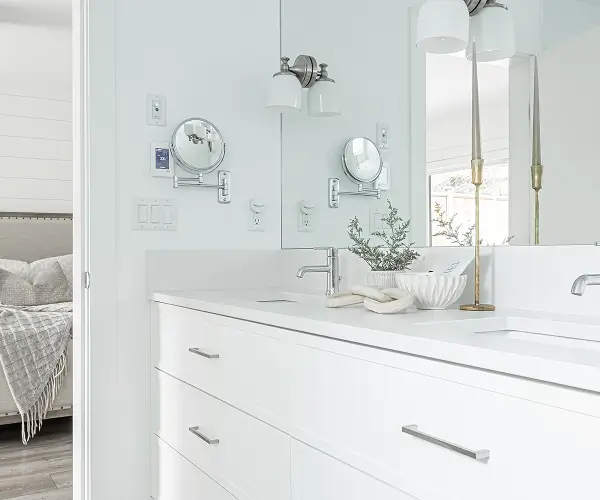 Custom home bathroom with a modern double vanity and white cabinetry by Bowline Construction in Langley, BC