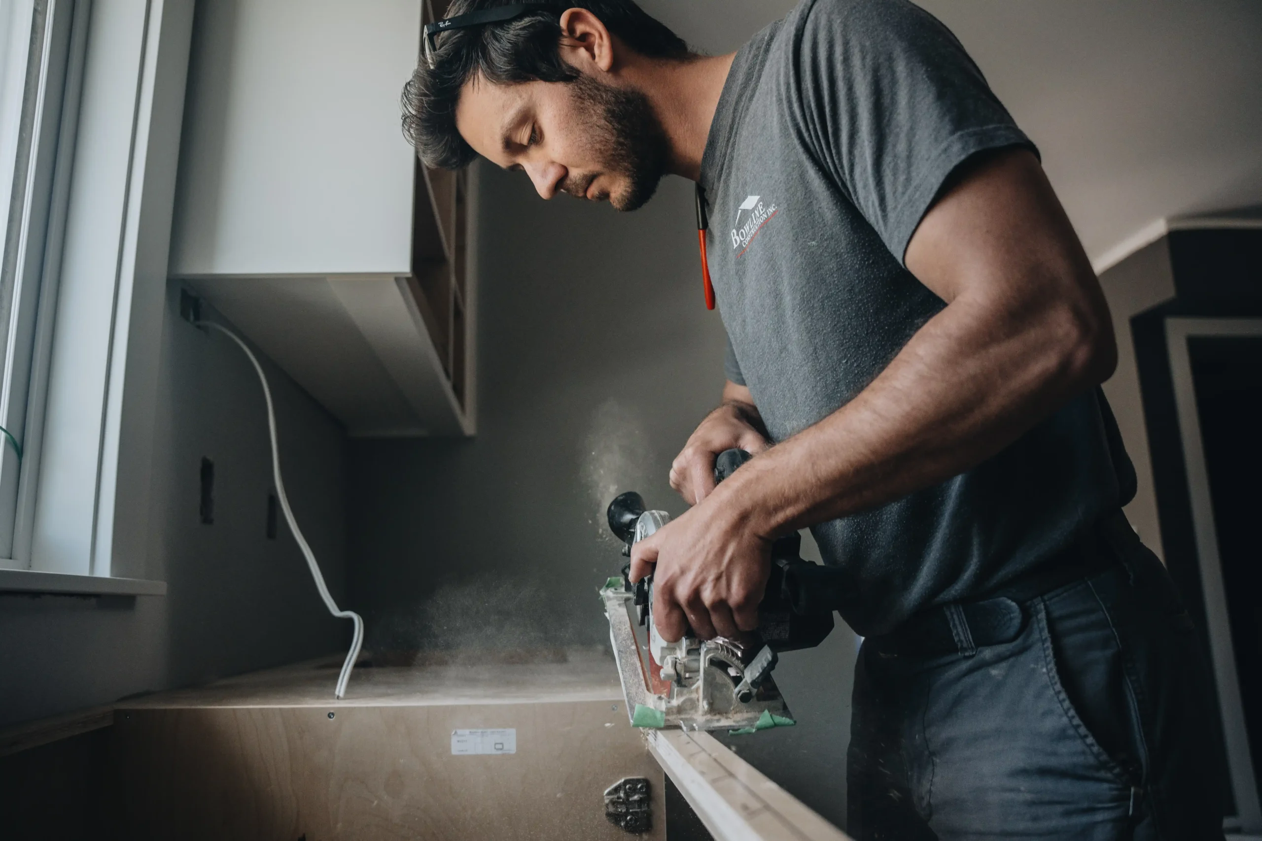 Bowline Construction craftsman uses a circular saw for finish carpentry detail on a custom home project in Langley, BC