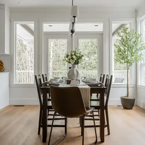Bright modern dining area with natural light and elegant design by Bowline Construction in Langley, BC