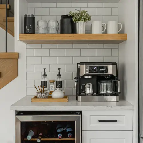 Stylish modern kitchen coffee station with espresso machine, open shelving, and white subway tile backsplash by Bowline Construction in Langley, BC.