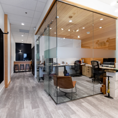 Open office with glass walls and meeting area built by Bowline Construction in Langley, BC