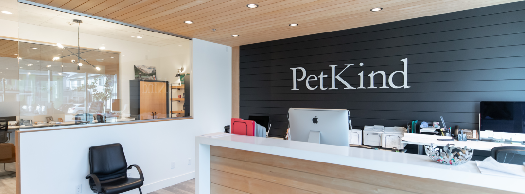 Reception area at PetKind featuring wood and glass accents as part of commercial tenant improvements by Bowline Construction in Langley, BC