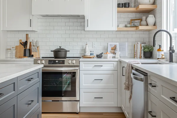White modern kitchen with subway tile backsplash and stainless steel oven showing home renovations Abbotsford by Bowline Construction in Abbotsford, BC