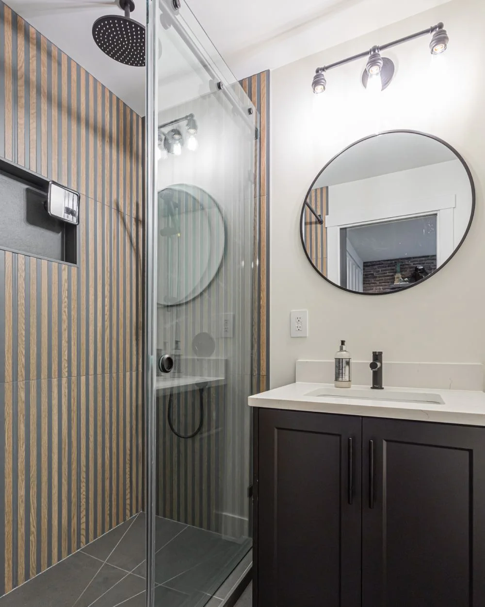 Modern bathroom renovation with glass shower and vanity by Bowline Construction in Maple Ridge, BC