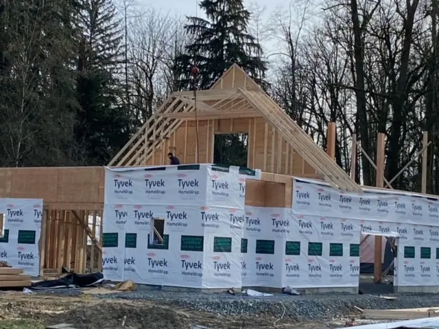 Framing and exterior wrap installation during home renovations by Bowline Construction