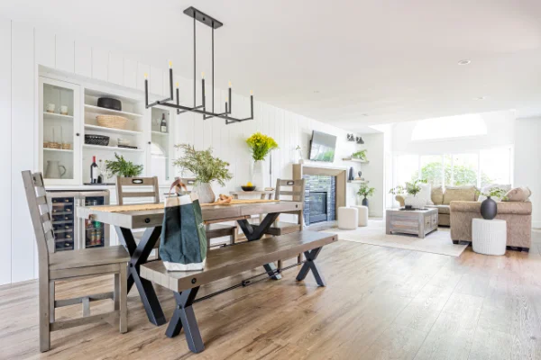 Modern open concept dining and living area with natural lighting by Bowline Construction in Surrey, BC